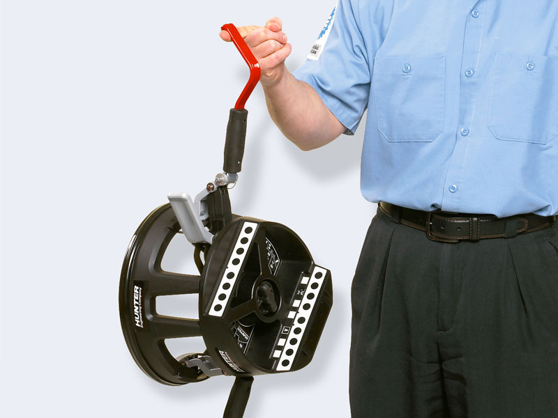 technician holding quickgrip adaptor by arm